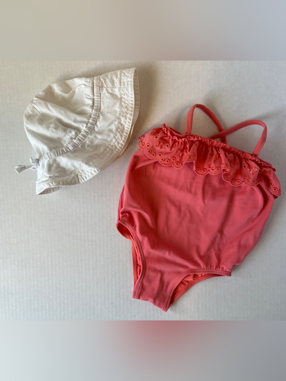 Coral Ruffle One-Piece Swimsuit with White Sun Hat